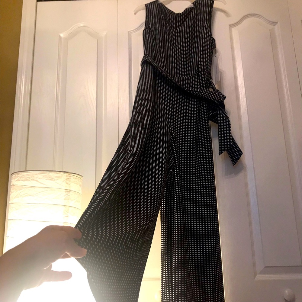 Jump suit.It’s black and white.